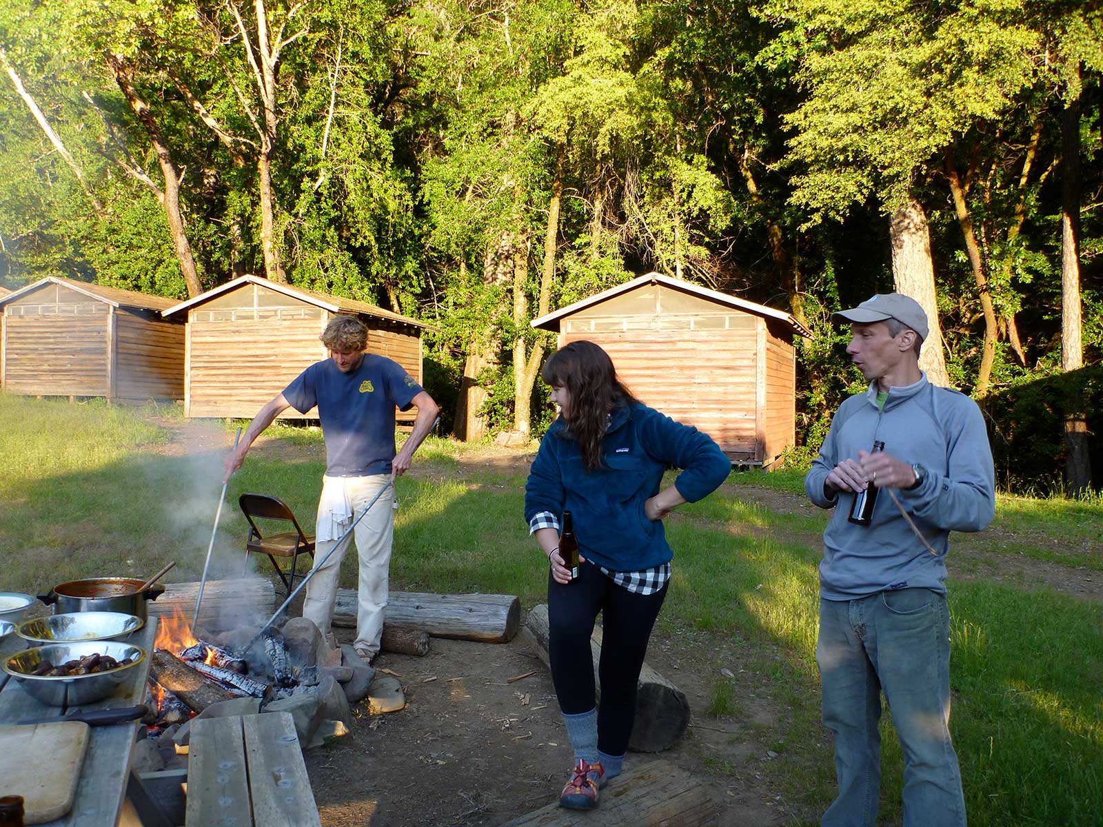Blake is cooking on the fire ring